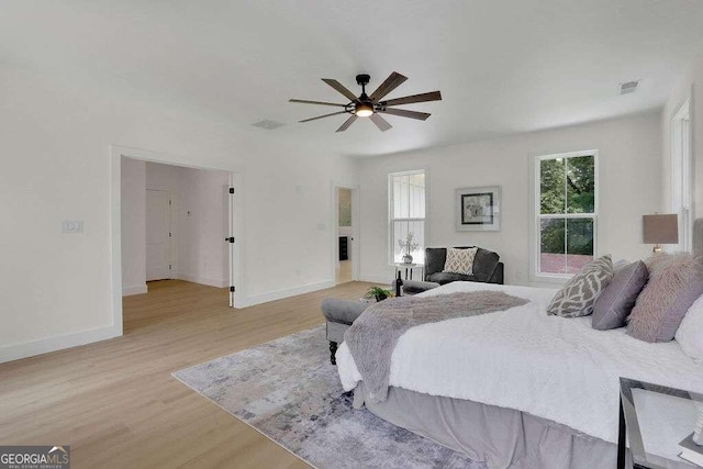 bedroom featuring light hardwood / wood-style flooring and ceiling fan