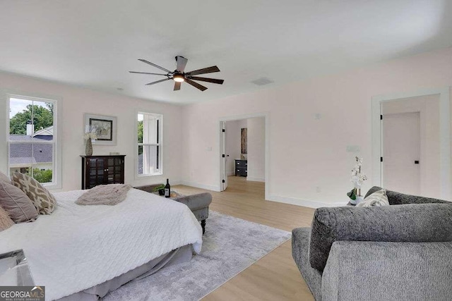 bedroom featuring light hardwood / wood-style floors and ceiling fan