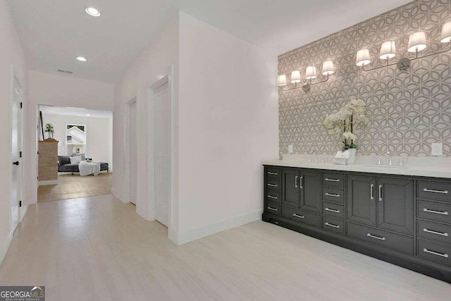 bathroom featuring hardwood / wood-style floors and vanity