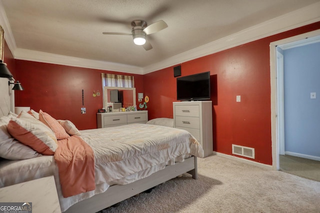 bedroom featuring ceiling fan, ornamental molding, and carpet floors