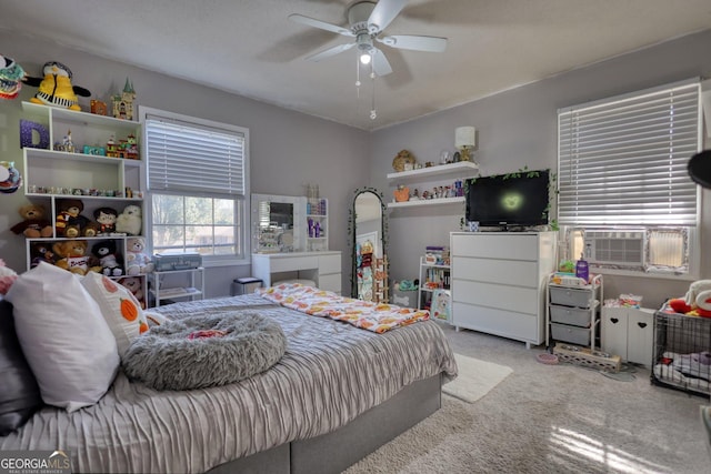 carpeted bedroom with ceiling fan, cooling unit, and a textured ceiling