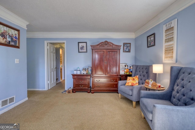 living area with a textured ceiling, light colored carpet, and ornamental molding