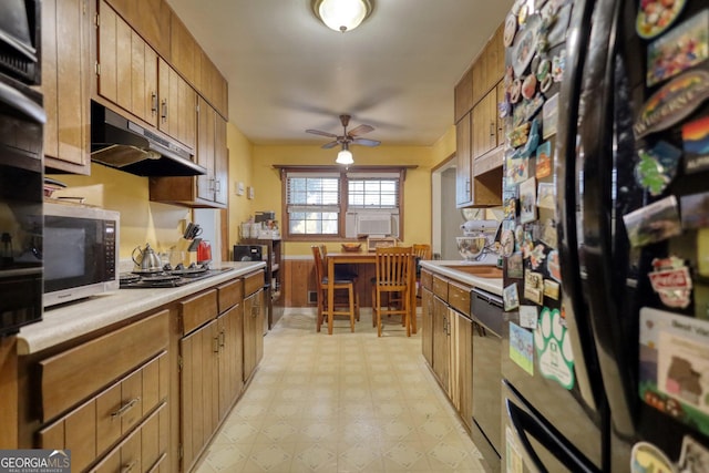 kitchen with ceiling fan, cooling unit, sink, and appliances with stainless steel finishes