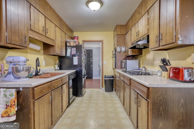 kitchen with black appliances and sink