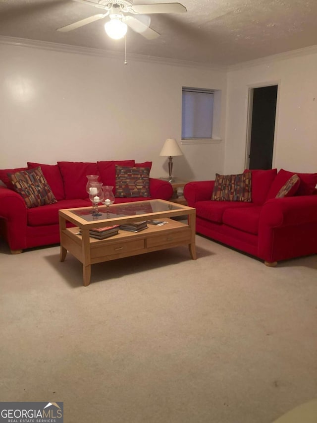 carpeted living room with a textured ceiling, ceiling fan, and crown molding