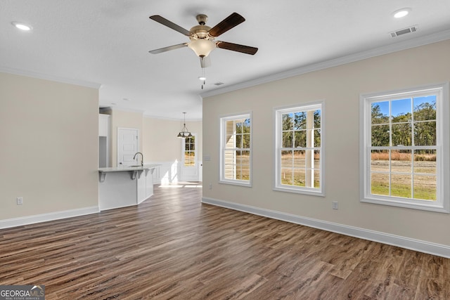 hallway featuring dark hardwood / wood-style floors and crown molding