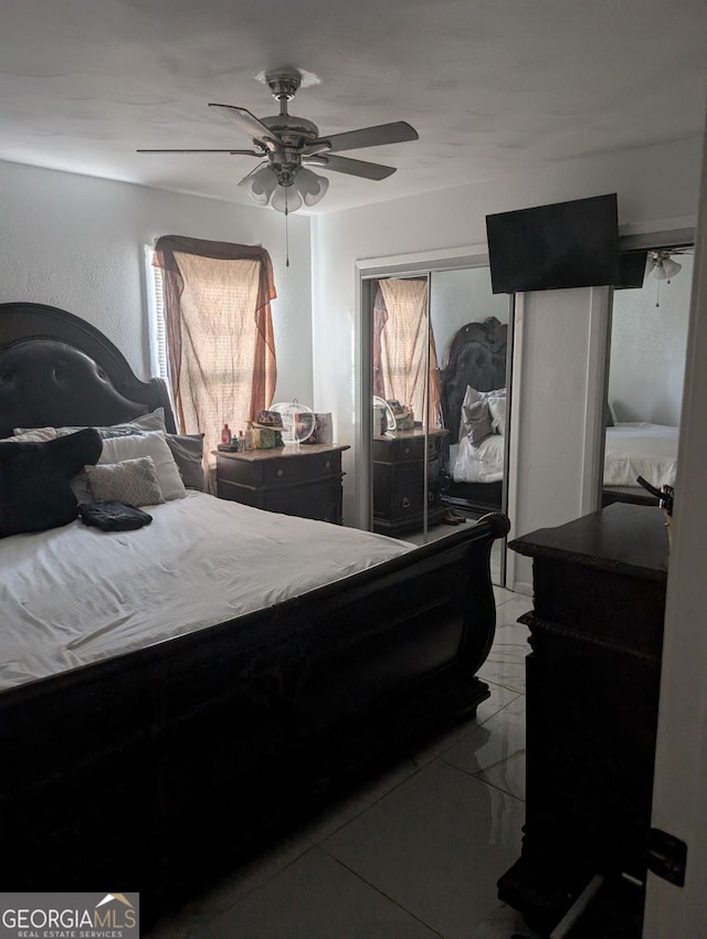 bedroom featuring ceiling fan and light tile patterned floors