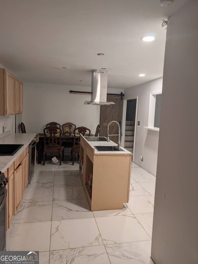 kitchen featuring dishwasher, light brown cabinetry, a barn door, and range hood