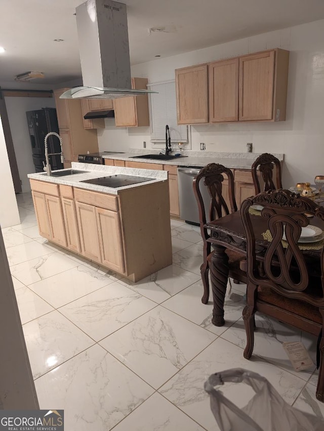 kitchen featuring island exhaust hood, a kitchen island with sink, light brown cabinetry, and sink