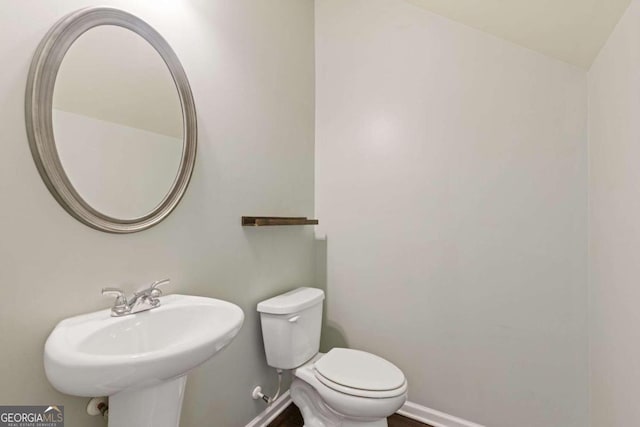 bathroom featuring toilet and sink