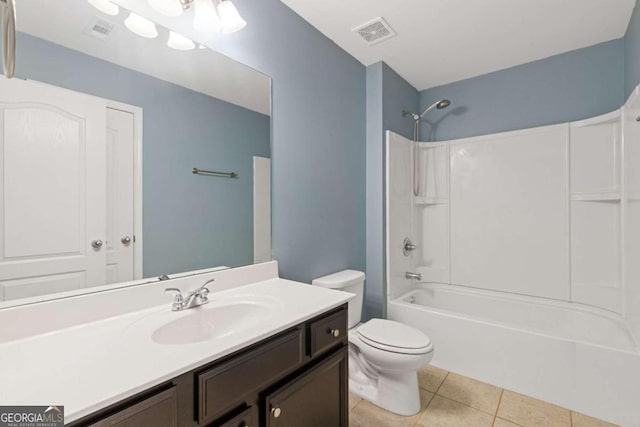 full bathroom with toilet, vanity, tile patterned floors, and bathtub / shower combination