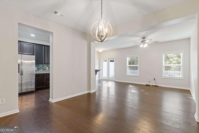 interior space with dark hardwood / wood-style flooring and ceiling fan with notable chandelier