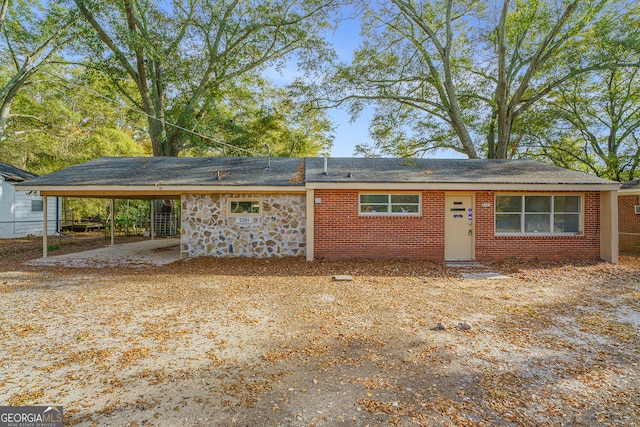 exterior space with a carport