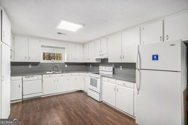 kitchen with white cabinetry, sink, white appliances, and dark hardwood / wood-style floors