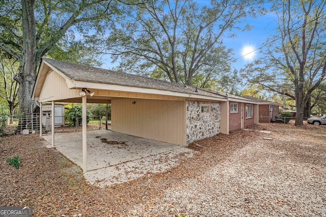 view of property exterior featuring a carport