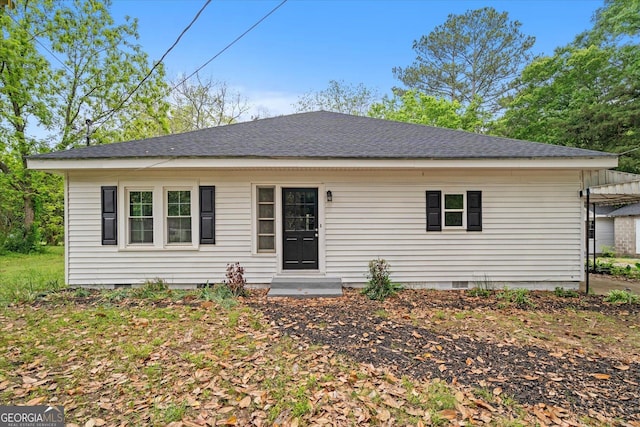 rear view of house with crawl space