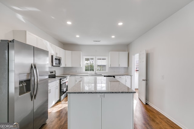 unfurnished bedroom featuring visible vents, dark wood-style flooring, and baseboards