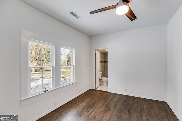 unfurnished room with ceiling fan and dark hardwood / wood-style floors