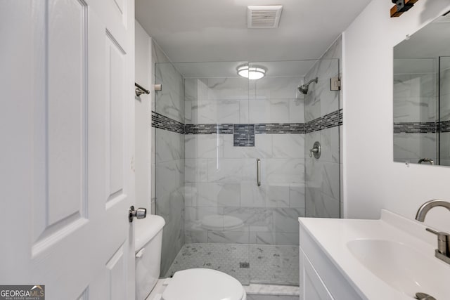 full bath featuring vanity and toilet