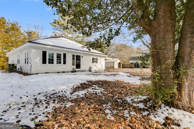 view of snow covered house