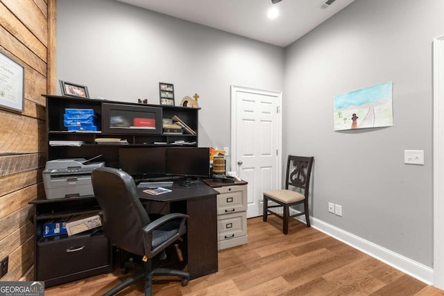 home office featuring light wood-type flooring and ceiling fan