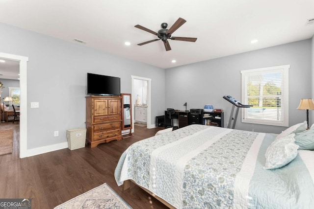 bedroom featuring dark wood-type flooring, ceiling fan, and ensuite bathroom