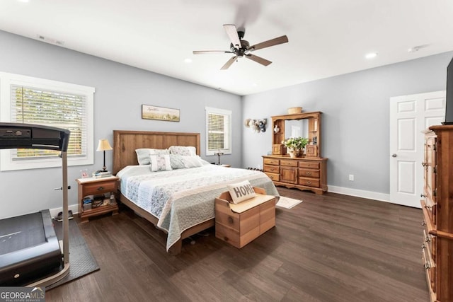 bedroom featuring ceiling fan and dark hardwood / wood-style floors