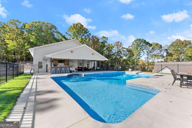 view of swimming pool with a patio