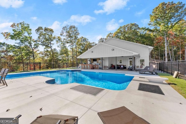 view of swimming pool with a patio area