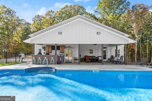 view of pool featuring a patio and outdoor lounge area