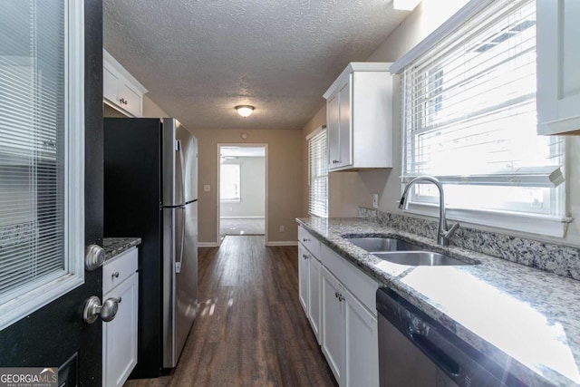 kitchen featuring white cabinetry, dark wood-type flooring, and sink