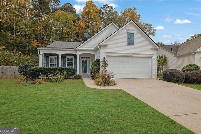 front of property featuring a front lawn and a garage