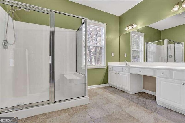 bathroom with an enclosed shower and vanity