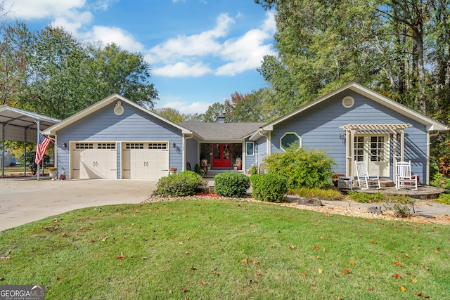 single story home with covered porch, a garage, a front yard, and a carport