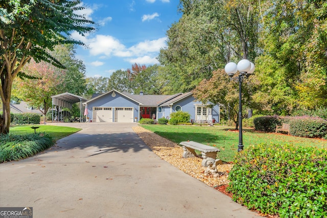 view of front of home featuring a garage, a carport, and a front lawn