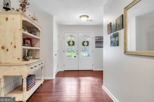 entrance foyer featuring french doors and dark hardwood / wood-style floors