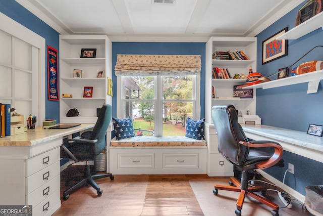 home office with light hardwood / wood-style floors and ornamental molding