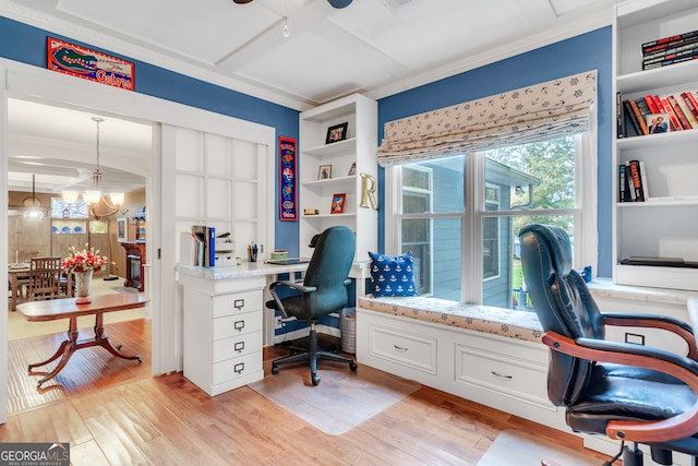 office area featuring ornamental molding, light hardwood / wood-style floors, a chandelier, and built in features