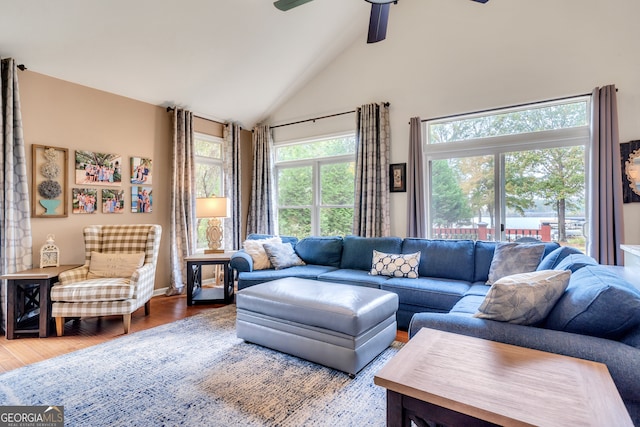 living room featuring high vaulted ceiling, wood-type flooring, and ceiling fan