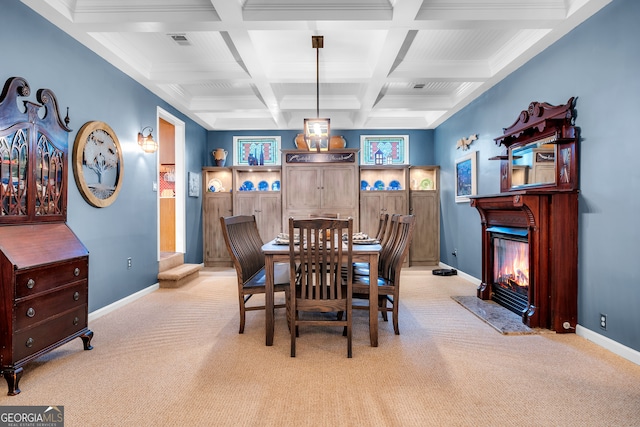 carpeted dining room with beamed ceiling, crown molding, and coffered ceiling