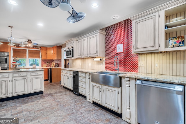 kitchen with backsplash, appliances with stainless steel finishes, hanging light fixtures, sink, and ceiling fan