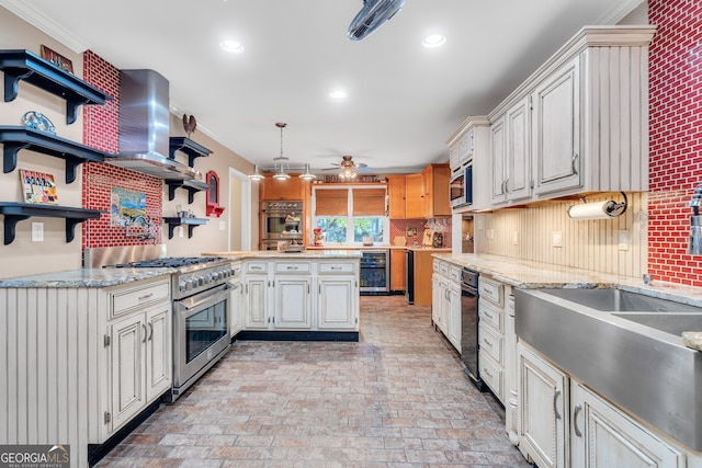 kitchen with ornamental molding, appliances with stainless steel finishes, hanging light fixtures, and wall chimney exhaust hood