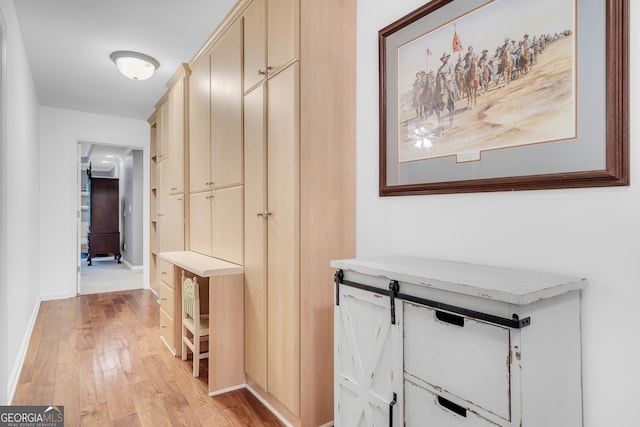 corridor featuring light hardwood / wood-style floors