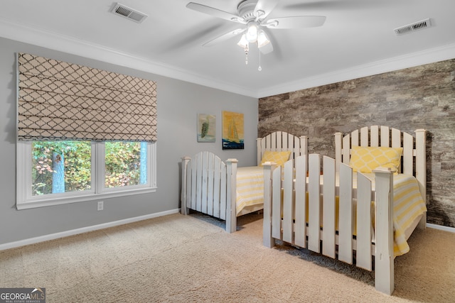 unfurnished bedroom featuring light colored carpet, ceiling fan, and crown molding