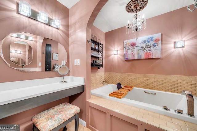 bathroom with a bathtub and a notable chandelier