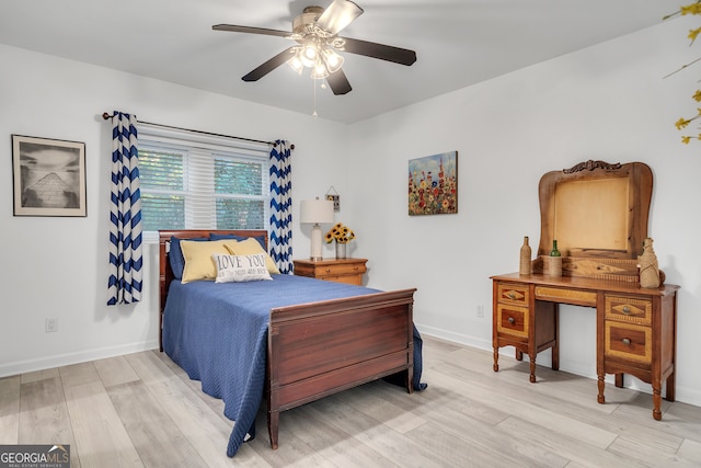 bedroom featuring hardwood / wood-style floors and ceiling fan