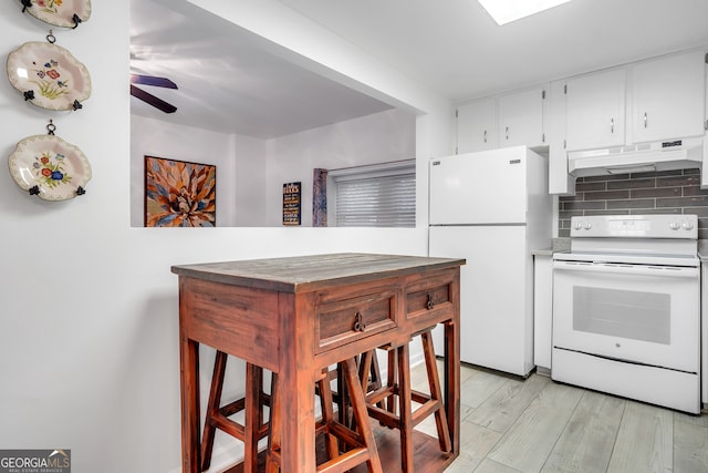 kitchen featuring light hardwood / wood-style floors, white cabinetry, ceiling fan, backsplash, and white appliances