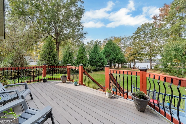 wooden terrace with a lawn