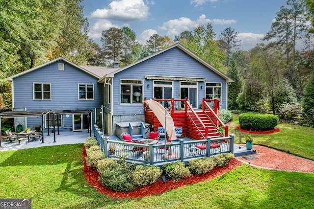 back of property featuring a patio, a yard, and a deck