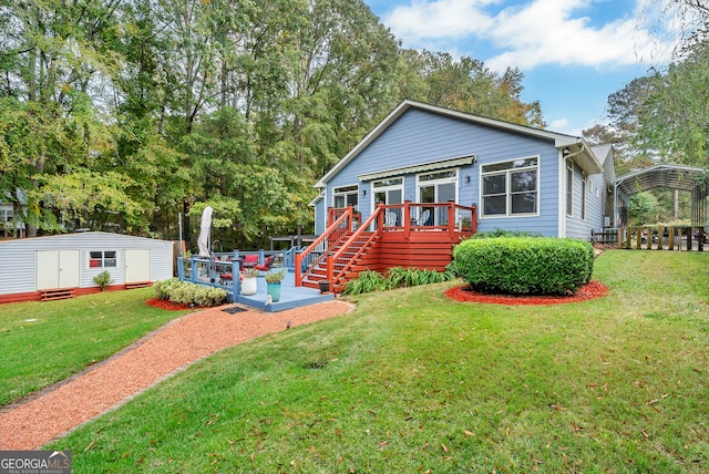 view of front of house with a shed, a front lawn, and a deck